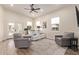 Bright and airy living room featuring wood floors, lots of natural light, and comfortable seating at 632 Aero Rd, Mesa, AZ 85205