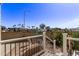 Step onto this elevated patio offering views of community palm trees and clear sky, a tranquil spot to unwind and enjoy the scenery at 632 Aero Rd, Mesa, AZ 85205