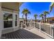 View of the deck, showcasing stylish railings and views of desert landscaping at 632 Aero Rd, Mesa, AZ 85205