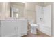 Bright bathroom showcases white vanity, toilet, mirror and a tub with shower, providing a clean and functional space at 6405 N 46Th Dr, Glendale, AZ 85301