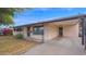 Well-maintained single-story home with a covered carport at 6405 N 46Th Dr, Glendale, AZ 85301