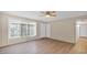 Bright living room with a ceiling fan and modern wood-look flooring at 6405 N 46Th Dr, Glendale, AZ 85301