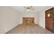 Cozy living room featuring a brick fireplace and wood-look flooring at 6405 N 46Th Dr, Glendale, AZ 85301