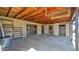 View of the covered patio with access to the yard with storage shelves and door to inside at 6405 N 46Th Dr, Glendale, AZ 85301