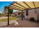 Backyard with a pergola, manicured lawn, and drought-tolerant landscape at 6494 W Matilda Ln, Glendale, AZ 85308