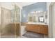 Bathroom featuring a glass shower, bathtub, and double sink vanity at 6494 W Matilda Ln, Glendale, AZ 85308