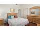 Bedroom featuring light colored walls, wood dresser, and wood floors at 6494 W Matilda Ln, Glendale, AZ 85308