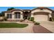 Charming single-Gathering home featuring manicured landscaping and a welcoming front entrance at 6494 W Matilda Ln, Glendale, AZ 85308