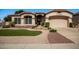 Charming single-Gathering home featuring manicured landscaping and a welcoming front entrance at 6494 W Matilda Ln, Glendale, AZ 85308