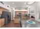 Spacious kitchen featuring stainless appliances, a center island, and an eat-in table at 6494 W Matilda Ln, Glendale, AZ 85308