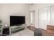 Neutral sitting area with hardwood floors and dark seating at 6494 W Matilda Ln, Glendale, AZ 85308