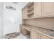 Mud room with built in cabinets, decorative rug, and door to outside at 6494 W Matilda Ln, Glendale, AZ 85308