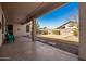 Covered patio with a view of a well-maintained backyard and desert landscape at 6494 W Matilda Ln, Glendale, AZ 85308