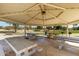 Spacious picnic area featuring multiple tables, seating, and barbecue grills perfect for outdoor gatherings at 6494 W Matilda Ln, Glendale, AZ 85308