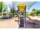 Community playground with shade, picnic benches, and a yellow slide at 6494 W Matilda Ln, Glendale, AZ 85308