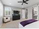 Bedroom featuring neutral walls, plush carpet, fan, and built-in shuttered windows at 6926 W Spur Dr, Peoria, AZ 85383