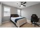 This bedroom features neutral walls, bright windows, and a cozy-looking queen bed at 6926 W Spur Dr, Peoria, AZ 85383