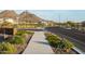 Picturesque community street lined with native plants and mountain views at 6926 W Spur Dr, Peoria, AZ 85383