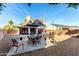 A partially covered outdoor dining area with seating for 6 at 7371 W Louise Dr, Glendale, AZ 85310