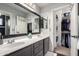 Bathroom with double vanity and walk-in closet at 7371 W Louise Dr, Glendale, AZ 85310