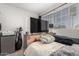 This bedroom features a large window providing natural light at 7371 W Louise Dr, Glendale, AZ 85310