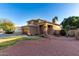 Home with a well-manicured lawn and an outdoor seating area in the backyard at 7371 W Louise Dr, Glendale, AZ 85310