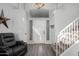 Bright foyer with vinyl floors, stairs, and a high ceiling at 7371 W Louise Dr, Glendale, AZ 85310