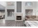 Bright living room featuring a fireplace and large windows for an airy and welcoming atmosphere at 7371 W Louise Dr, Glendale, AZ 85310