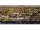 Expansive aerial view showcasing the home's location within a neighborhood with mature trees and mountain views at 7819 N 17Th Ave, Phoenix, AZ 85021