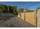 Backyard with concrete block perimeter fence and a wooden fence at 7819 N 17Th Ave, Phoenix, AZ 85021