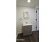Bright bathroom featuring a modern vanity with sleek hardware and a square mirror at 7819 N 17Th Ave, Phoenix, AZ 85021