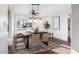 Contemporary dining room featuring a stylish light fixture, modern furniture and large windows at 7819 N 17Th Ave, Phoenix, AZ 85021