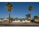 Charming home with lush palm trees accenting the front, enhancing the property's curb appeal at 7819 N 17Th Ave, Phoenix, AZ 85021