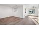 Living room featuring hardwood floors, neutral paint, and a large window at 7819 N 17Th Ave, Phoenix, AZ 85021