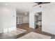 Bright, open living area featuring wood floors, ceiling fan, and an adjacent renovated kitchen at 7819 N 17Th Ave, Phoenix, AZ 85021