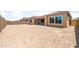 A partially fenced backyard with a view of the back of the home at 7854 W Mockingbird Way, Florence, AZ 85132
