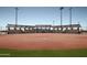 Well-maintained baseball field with covered seating and lush green outfield at 7854 W Mockingbird Way, Florence, AZ 85132