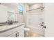 Modern bathroom boasts granite counters, bright white cabinetry, and a shower-tub combo at 7854 W Mockingbird Way, Florence, AZ 85132