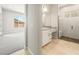 Modern bathroom showcasing a walk-in shower, granite countertops, and white cabinets at 7854 W Mockingbird Way, Florence, AZ 85132