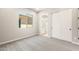 Clean bedroom with light gray carpet, and a closet with white sliding doors at 7854 W Mockingbird Way, Florence, AZ 85132