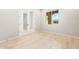 Bright bedroom with hardwood floors, a double door closet, and a view of the exterior at 7854 W Mockingbird Way, Florence, AZ 85132