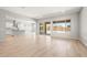 Open concept living space with hardwood floors and large windows offering plenty of natural light at 7854 W Mockingbird Way, Florence, AZ 85132