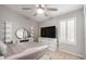 Bright bedroom with large dresser, vanity, and closet offers ample storage and natural light at 7866 W Taro Ln, Glendale, AZ 85308