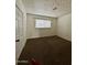 Comfortable bedroom featuring neutral carpet, a window and a closet at 7921 W Pinchot Ave, Phoenix, AZ 85033