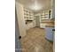 Spacious pantry and laundry room, with ample shelving and counter space at 7921 W Pinchot Ave, Phoenix, AZ 85033