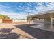 Large backyard with gravel cover, a covered patio, and secure fencing at 800 W 12Th St, Tempe, AZ 85281