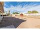 Large backyard with gravel ground cover and mature trees, offering ample space at 800 W 12Th St, Tempe, AZ 85281