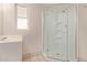 Bathroom with corner glass shower, vanity, and window at 800 W 12Th St, Tempe, AZ 85281