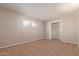 Bedroom featuring carpet, a closet with bi-fold doors, and a window at 800 W 12Th St, Tempe, AZ 85281