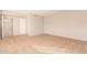 View of a clean, carpeted bedroom with a full-length mirror and tan walls at 800 W 12Th St, Tempe, AZ 85281